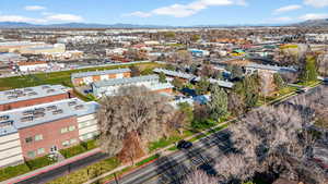 Drone / aerial view of a mountainous background and an industrial area
