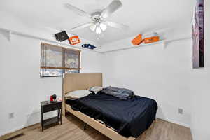 Bedroom featuring light wood-type flooring and ceiling fan