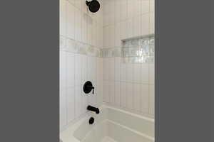 Full bathroom with shower / tub combination