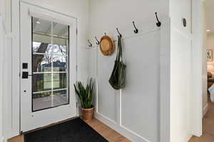 Mudroom with light wood finished floors