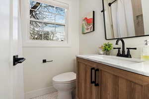 Bathroom featuring vanity and a shower with shower curtain