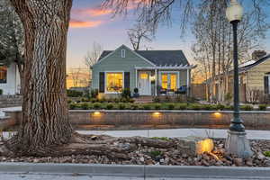 Bungalow-style home with roof with shingles