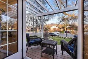 Deck featuring a residential view and a pergola