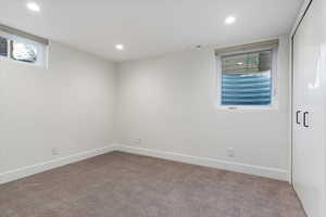 Spare room with carpet floors and recessed lighting