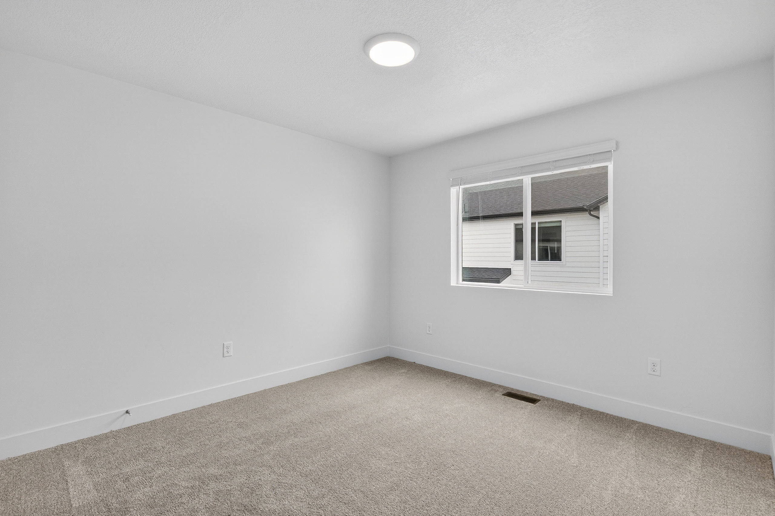 Unfurnished room featuring carpet floors and baseboards