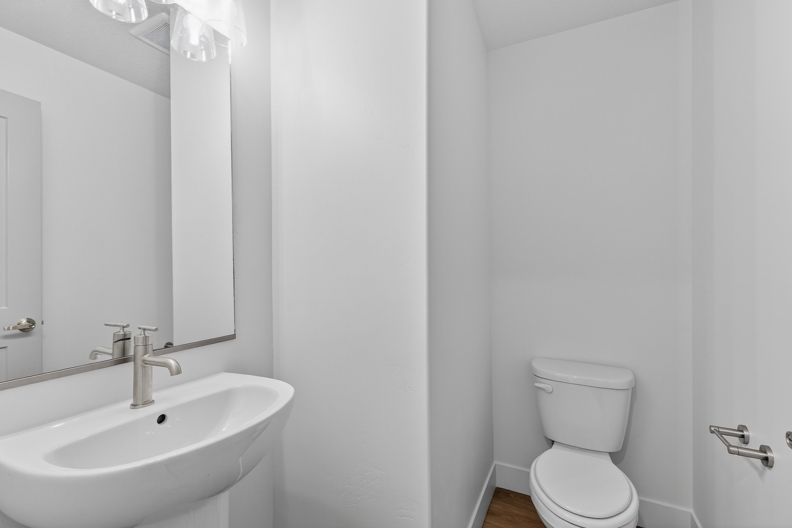 Half bath with toilet and a sink