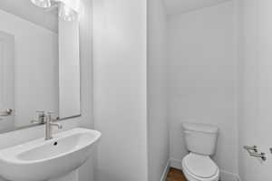 Half bath with toilet and a sink