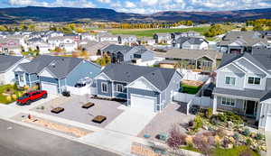 Aerial view of residential area featuring a mountain backdrop