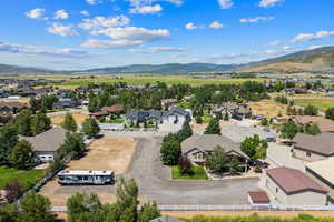Aerial perspective of suburban area featuring a mountain backdrop