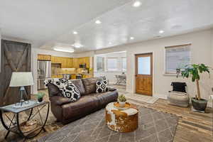 Living room with wood finished floors and recessed lighting