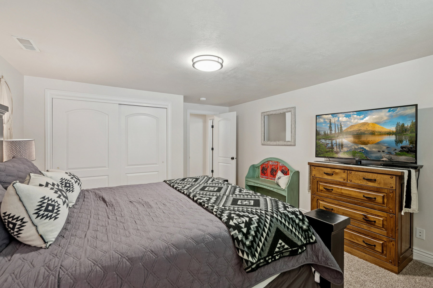Bedroom with a closet and light carpet