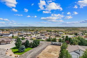 Aerial perspective of suburban area with a mountainous background