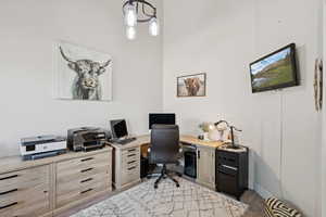 Office with carpet flooring and baseboards