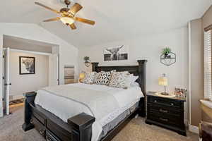Bedroom featuring light carpet and ceiling fan
