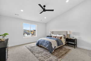 Bedroom with light carpet, vaulted ceiling, ceiling fan, and recessed lighting
