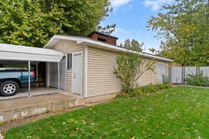 View of 3rd car garage with shed