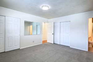 Primary bedroom with 2 closets and en-suite bathroom