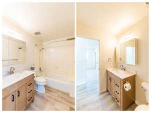 Main floor full bathroom with vanity, light wood-type flooring,