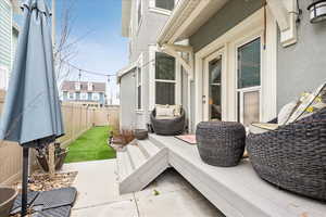 Fenced backyard with a patio area