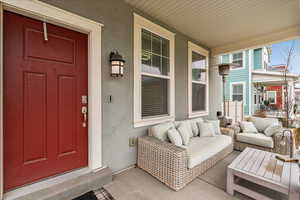 Property entrance with covered porch