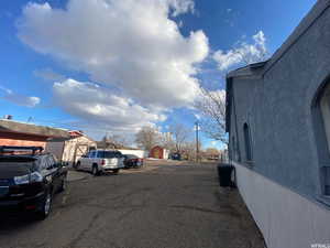 View of asphalt street featuring a residential view
