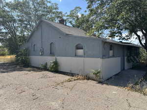 View of home's exterior with a chimney