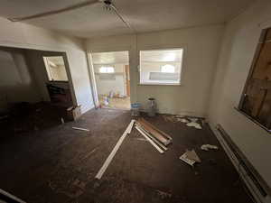 Unfurnished room featuring baseboard heating