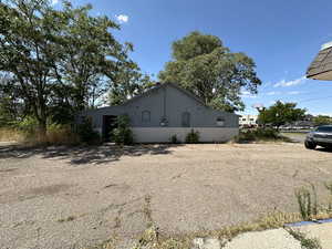 View of side of property featuring stucco siding