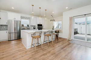 Kitchen, Island and Sliding Glass Door