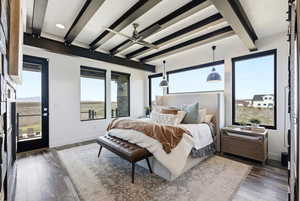 Bedroom featuring beamed ceiling and dark wood-type flooring