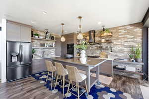 Kitchen featuring open shelves, black appliances, modern cabinets, and light countertops