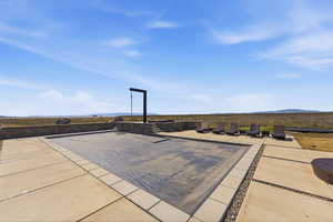 View of swimming pool with a mountain view and patio surround