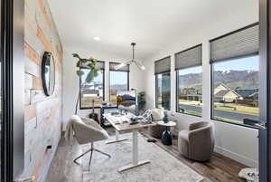 Office space featuring baseboards and wood finished floors