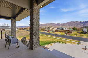View of patio / terrace with a residential view and a mountain view