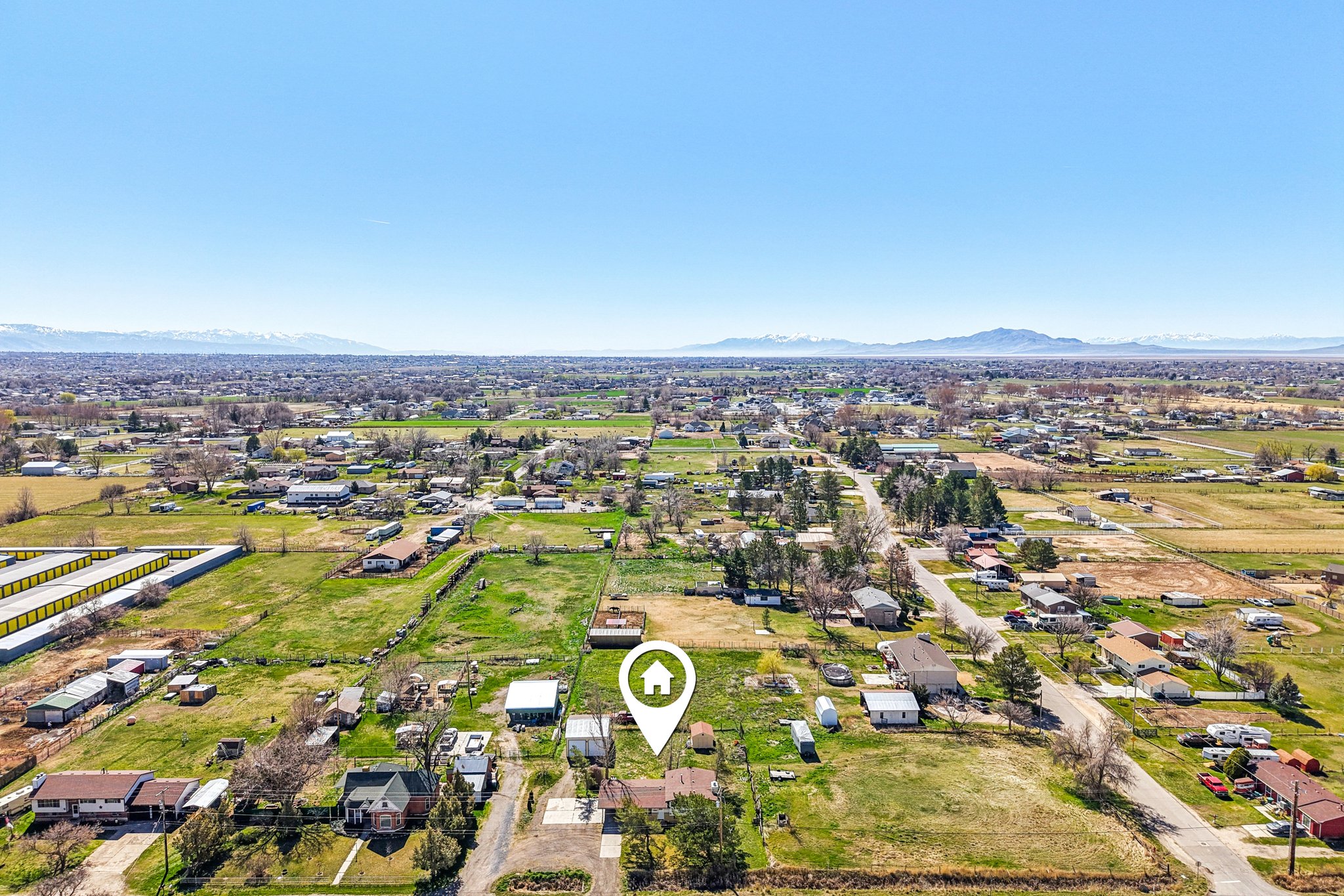 Aerial perspective of suburban area with a mountainous background