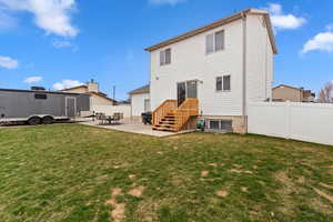 Rear view of property featuring a patio area