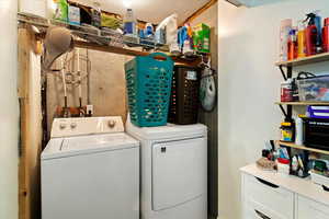 Laundry area featuring washing machine and clothes dryer