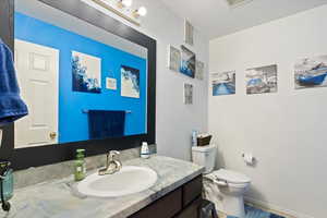 Bathroom featuring vanity and a textured ceiling