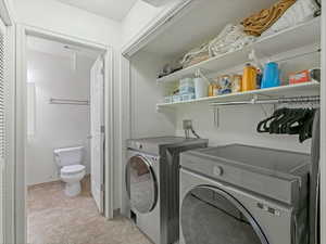 Laundry area featuring washing machine and clothes dryer