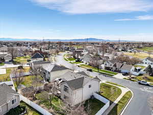 Aerial perspective of suburban area featuring a mountainous background