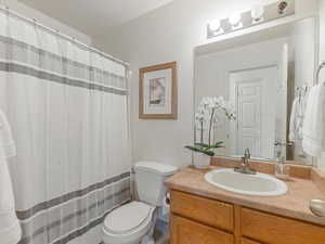 Full bath featuring vanity and a shower with curtain
