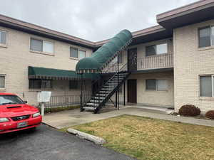 View of apartment building / complex with stairs