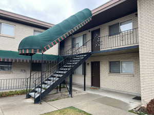 View of property featuring stairs