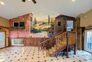 Staircase featuring wainscoting, a ceiling fan, recessed lighting, and wood walls