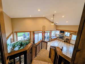 Corridor featuring lofted ceiling and recessed lighting