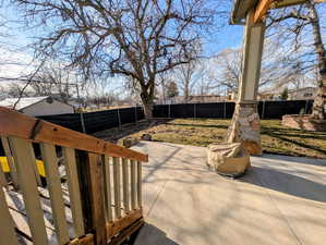 Fenced backyard featuring a patio area