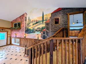 Kitchen featuring lofted ceiling and ceiling fan
