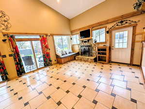 Living room featuring lofted ceiling and a fireplace