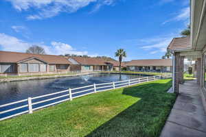 View of yard with a water view and a residential view