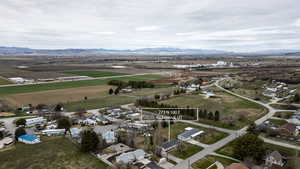 View of rural area featuring a mountain backdrop and nearby suburban area